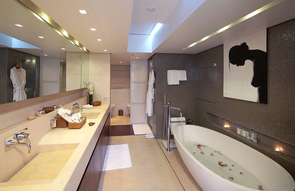 Bathroom with bathtub filling