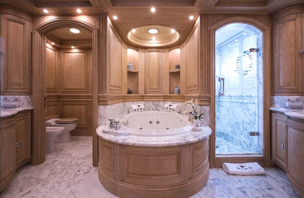 Master bathroom with shower and bathtub on yacht Nero