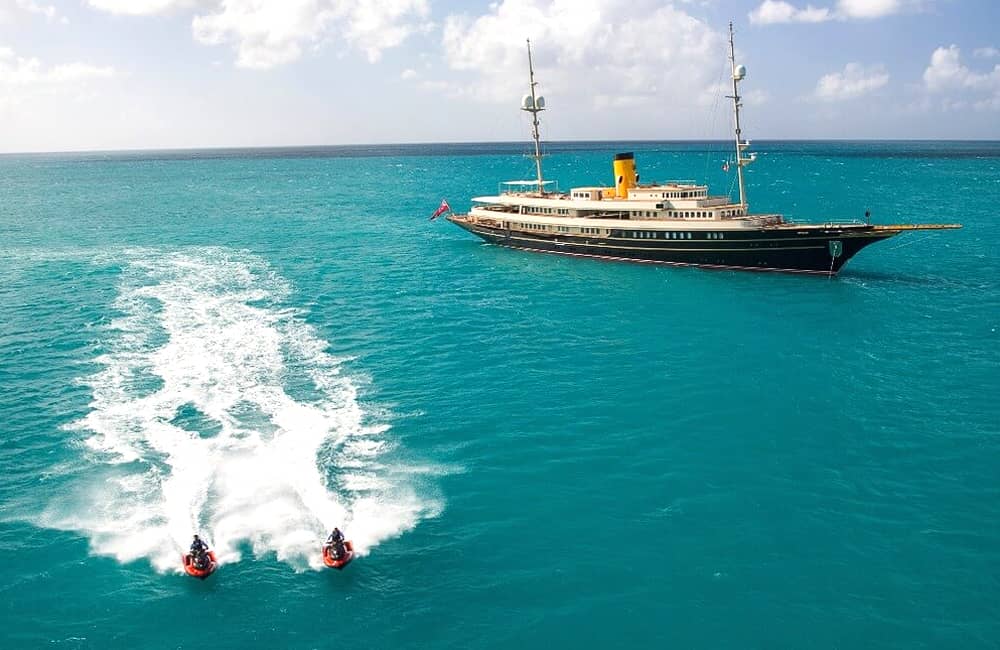 Starboard view of yacht Nero with jet skis