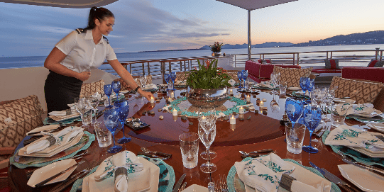 Yacht-Stewardess-Setting-Table