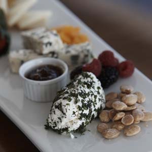 Cheese, fruit and nut platter server on a yacht