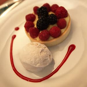 Custard and berry dessert with ice cream