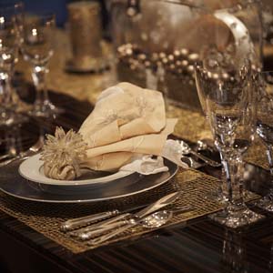 Elegant place setting with gold placemat