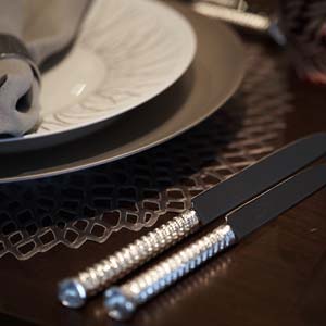 Silver knives with elegant place setting