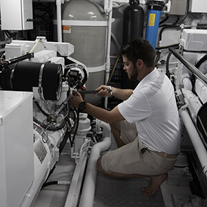 Yacht Engineer working on equipment