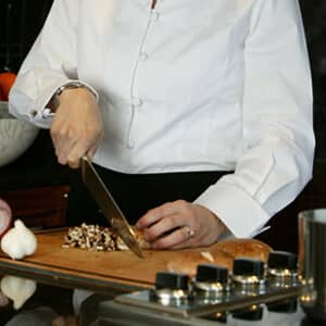 Yacht cook chopping mushrooms