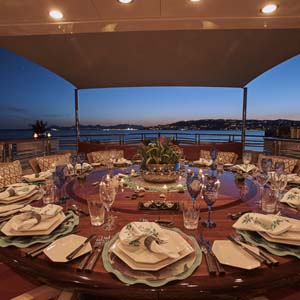Yachts round table setting for 12 at dusk